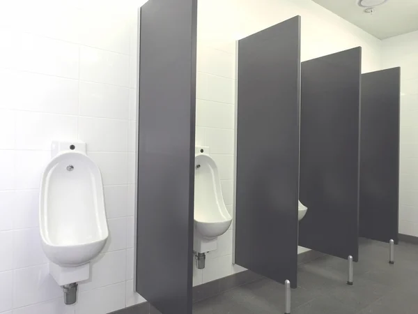 Row of Urinal bowls with automatic hands free flush — Stock Photo, Image