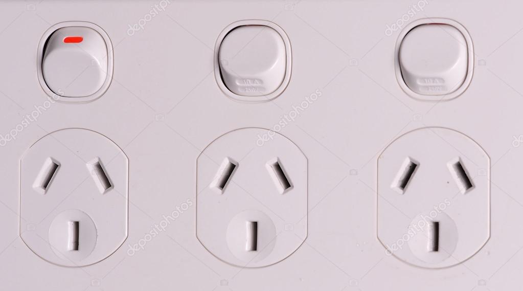 Three fold low voltage power wall outlets with one switched on — Stock ...