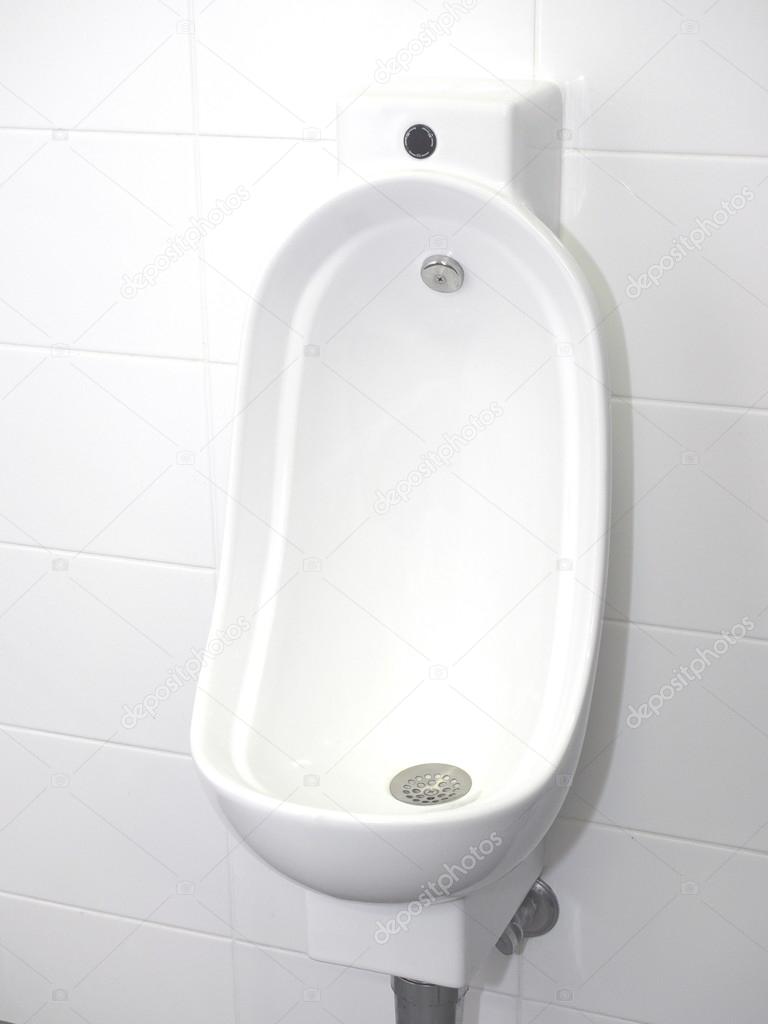 Urinal bowl with automatic hands free flush Stock Photo by ©Stringer