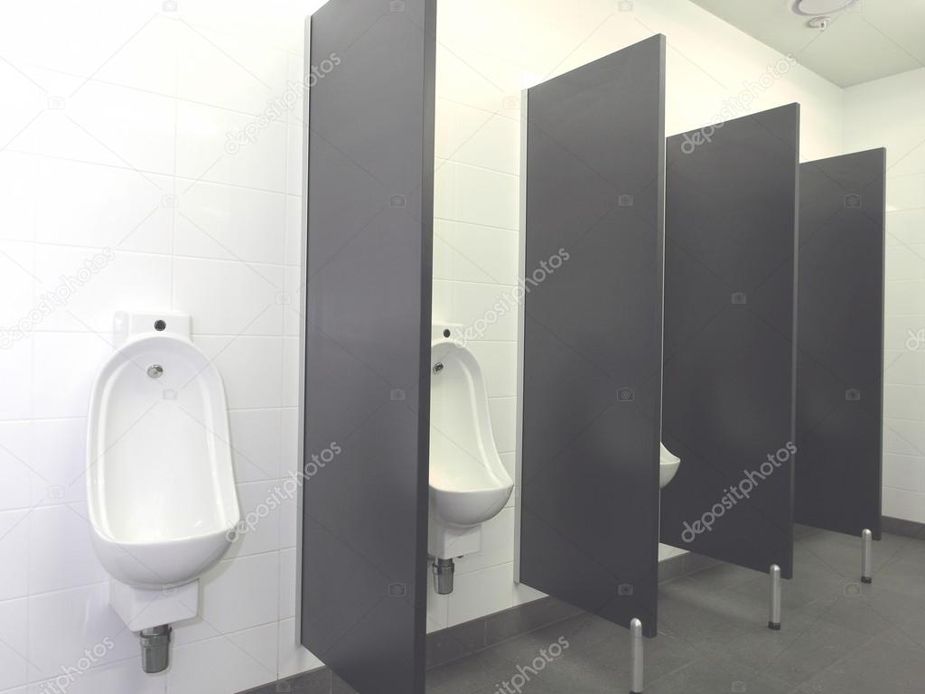 Row of Urinal bowls with automatic hands free flush