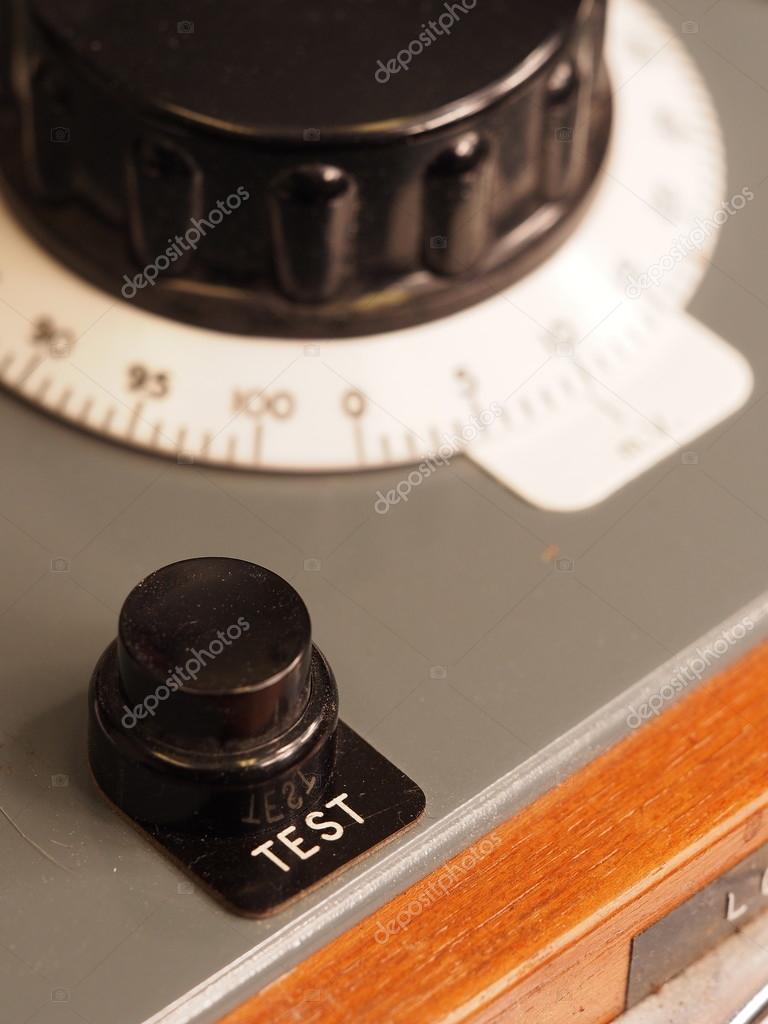 Test button and background knob of an old test apparatus