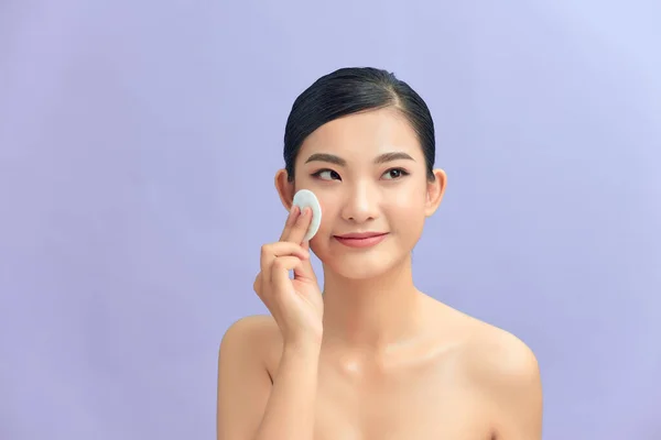Crop Attractive Young Female Cleansing Face Cotton Pad Purple Background — Stock Photo, Image