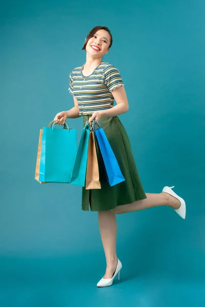 Girl Stands One Leg Holds Purchases Her Hands Shopping — Stock Photo, Image