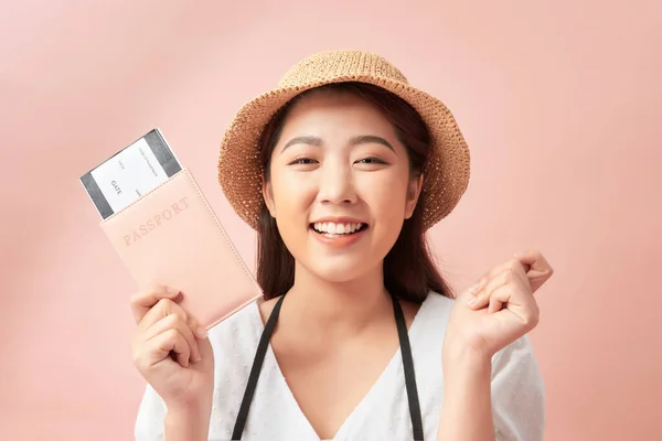 Happy Woman Shows Her Passport Camera Isolated Pink Background — Φωτογραφία Αρχείου