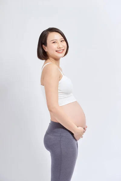 Mulher Grávida Acariciando Sua Barriga Sobre Fundo Branco — Fotografia de Stock