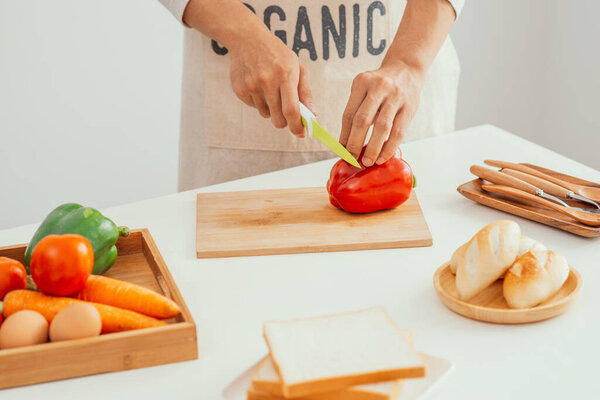 Male hands making breakfast