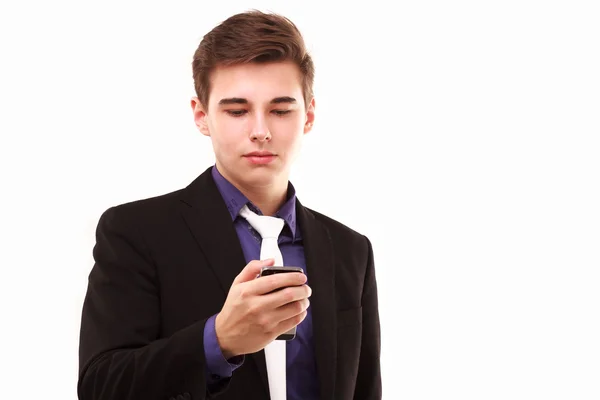 Young businessman seriously looking to the phone — Stock Photo, Image