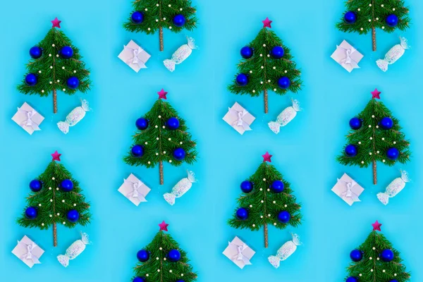 Repeating pattern of Christmas trees on a turquoise background. Christmas or New Year concept for wrapping papers, covers and any other design idea.