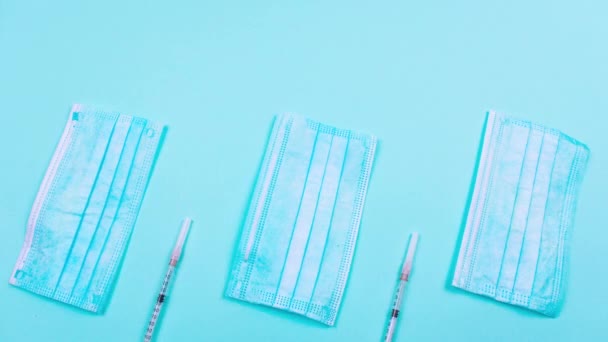 Masks Syringes Vaccine Vials Move Light Blue Background Concept Medicine — Stock Video