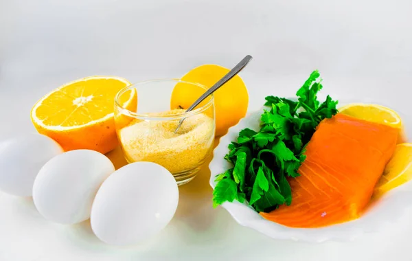 Foods containing collagen. Gelatin, eggs, fish, greens, citrus fruits containing collagen and are necessary for its synthesis for youthful skin and healthy joints. White background. Copy space.