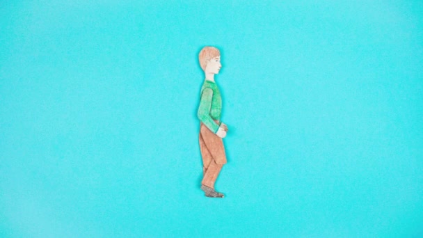 Kahverengi Pantolonlu Yeşil Gömlekli Drawn Genci Açık Mavi Arka Planda — Stok video