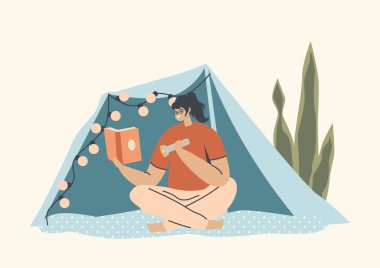 Kadın Işığın Kaynağını Kullan. Ev eğlencesi, boş zaman. Battaniye Çadırı Altında Oturan Kadın Karakteri Üzerinde Çelenk Madalyası