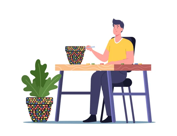 Hobby creativo, artesanía, concepto de arte. Hombre personaje configurar mosaico, Hombre joven sentado en el escritorio decorar maceta — Vector de stock