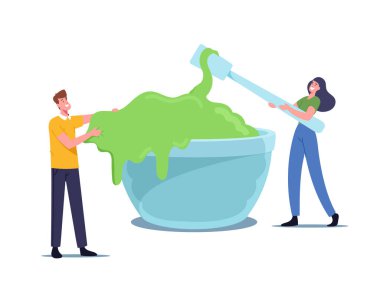 Neşeli insanlar sümük yapıyor, eğleniyor. Küçük Erkek ve Kadın Karakterler Büyük Kâse 'de Yeşil Yapışkan İçindekileri Karıştırıyor