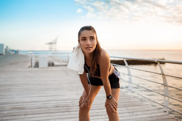 girl training at sunrise over seaside