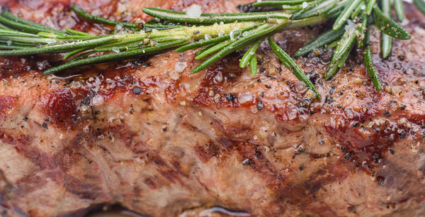Grill beef steak with rosemary