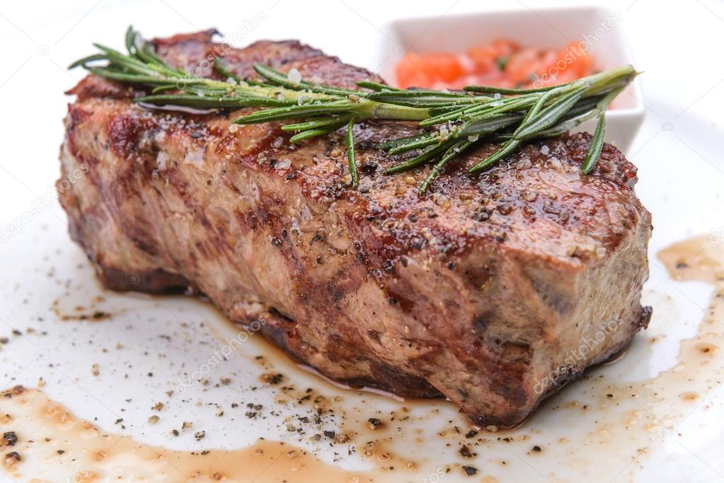 Grill beef steak with rosemary