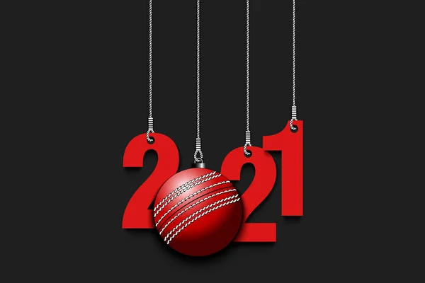 2021 New Year and cricket ball hanging on strings