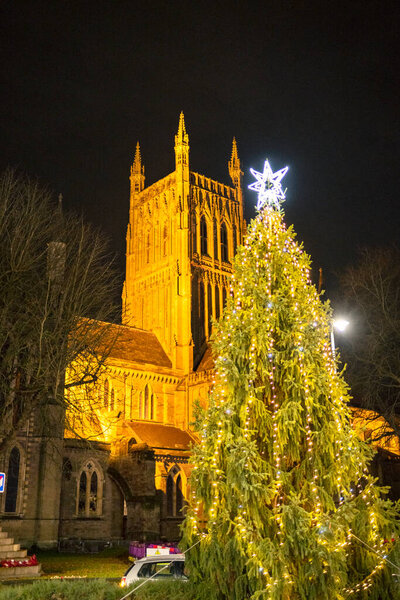 Worcestershire,England-November 29 2024: Festive illuminations, and Christmas tree,brightly lit,in the square opposite the historic Cathedral ,during the buildup to the Xmas holiday.