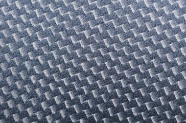 Koyu gri karbon fiber dokusu modern dokuma desenini gösteriyor. Endüstriyel ve güçlü bir endüstriyel tasarım ve endüstriye karşı duyarlı parlak bir malzeme.