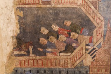 Geleneksel Tayland insanlarının dini tören sırasında sakin yüzleri ve barışçıl ifadeleriyle tapınak duvarları dokusunu yıpratırken oturdukları bir grup eski duvar resmini ayrıntılı bir şekilde gösteriyor.