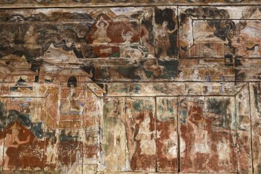 Tapınak duvarında antik duvar resmi, tarihi dini fresk. Eski bir uygarlığın eskimiş, solmuş sanatı mitolojinin ebedi, ruhani sahnesini tasvir eder.