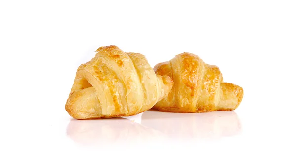 Croissant zblízka izolované na bílém pozadí — Stock fotografie