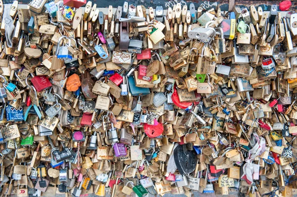 The tradition of leaving pad locks on a bridge to represent love and memories