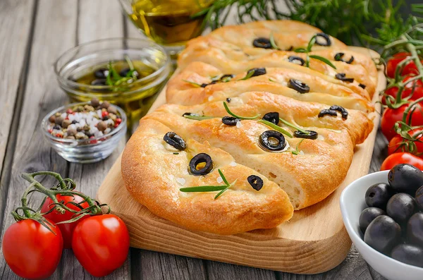 Italian focaccia bread with olives and rosemary — Stock Photo, Image