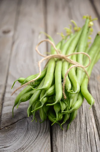 Franse bonen op houten achtergrond — Stockfoto