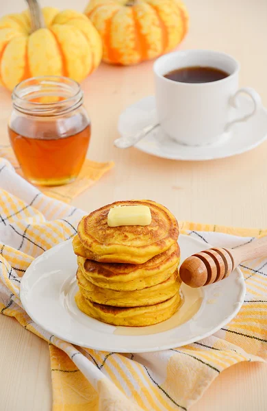 Pumpkin pancakes with butter and honey — Stock Photo, Image