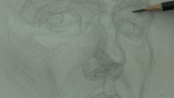 Рисунок быстрого изучения глаз и носа молодого человека с помощью графитового карандаша — стоковое видео