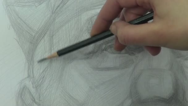 Drawing a study of old man's portrait with graphite pencil — Stock Video