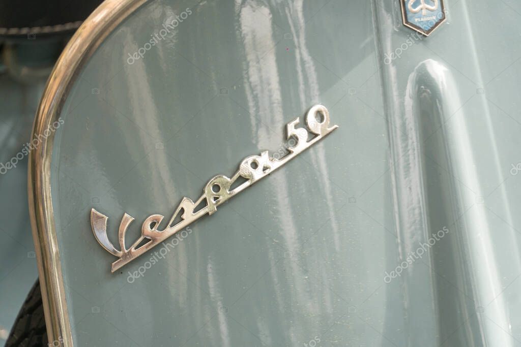 Rome, Italy - May 28, 2019: Emblem of a classic Vespa 50 scooter. Vespa is an Italian brand of scooter manufactured by Piaggio