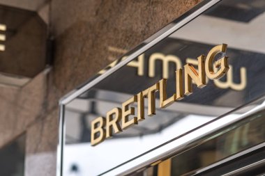 Hamburg, Germany - March 28, 2021: Breitling signage. Breitling SA is a Swiss luxury watchmaker, known for precision-made chronometers designed for aviators  clipart