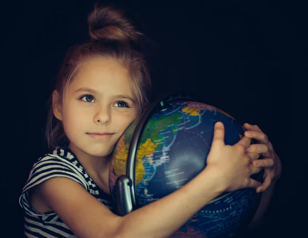 Beautiful girl hugging a globe — Stock Photo, Image