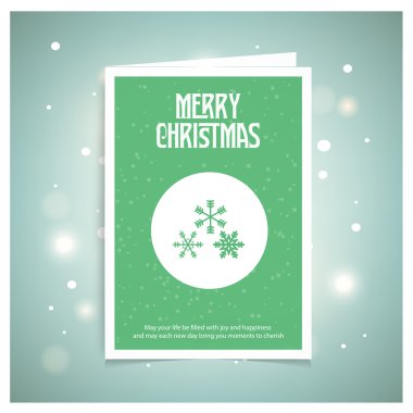 İçinde kar taneleri olan bir Noel kartı.