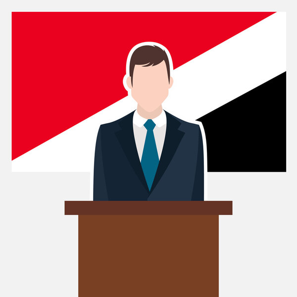 Man in suit standing at rostrum 