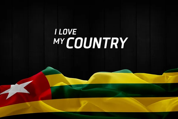 Togo hullámzó zászlaja — Stock Fotó
