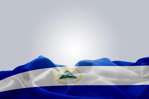 Acenando tecido abstrato bandeira Nicarágua — Fotografia de Stock