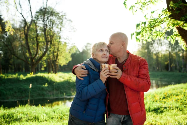 Happy seniors couple embrace and smile; — Stock Photo, Image