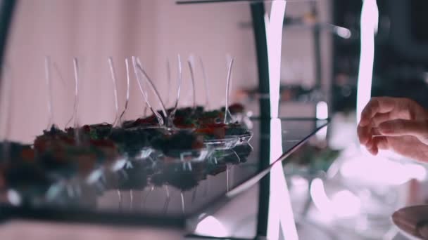 Closeup of hand take molecular cuisine dish at banquet on event in restaurant — Stok Video