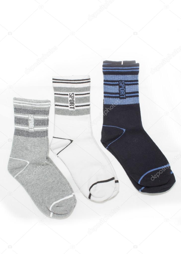 Grey, white and blue sport socks, isolated