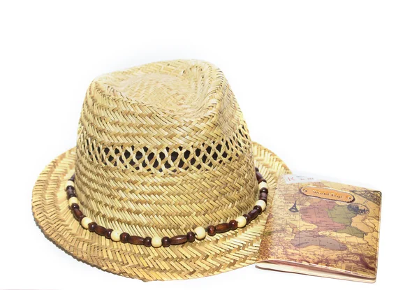 Straw hat and passport isolated on white — Stock Photo, Image