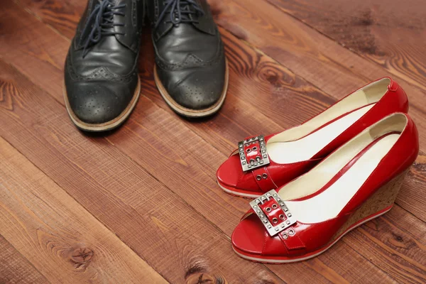 Classic style man and woman shoes on wooden background