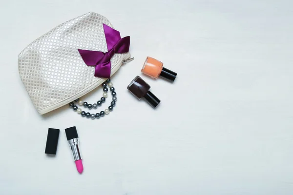 Make up bag with cosmetics and brushes on wooden background — Stock Photo, Image