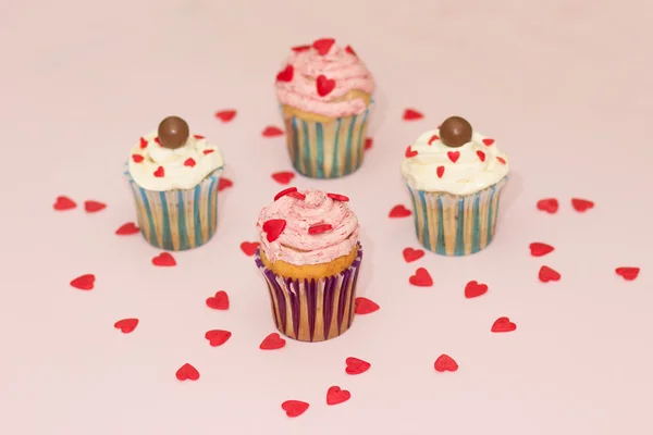 Cupcakes desert cream pink and white on pink background — Stock Photo, Image