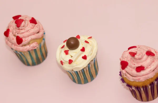 Cupcakes desert cream pink and white on pink background — Stock Photo, Image