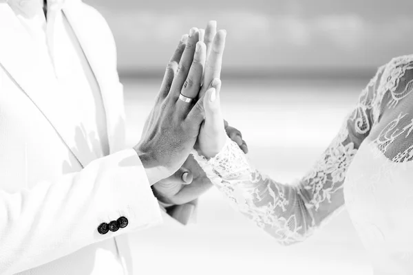 Closeup of a couple with wedding rings after a ceremony on the beach. Destination wedding. — Stock Photo, Image