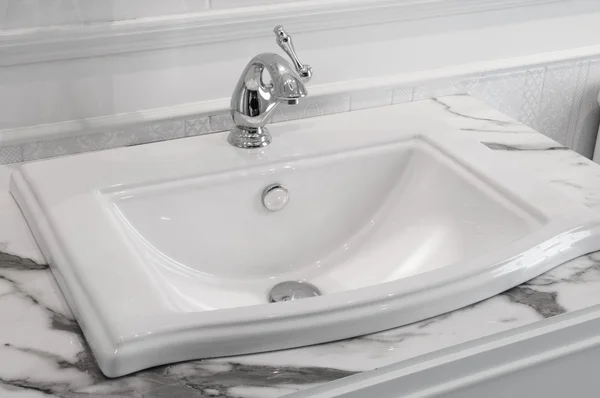 The faucet in the bathroom sink — Stock Photo, Image